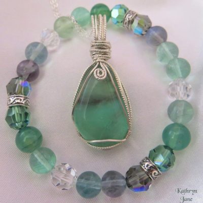 Tumbled fluorite gemstone pendant with matching fluorite , crystal and sterling silver bracelet.