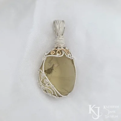 14k gold-filled (14/20) spiral details on sterling silver pendant. Such a gorgeous tumbled lemon quartz.