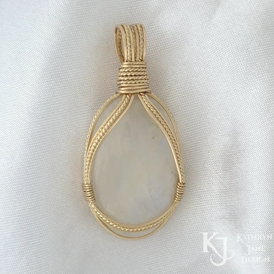 Classic 'halterneck' design of square wires either side of a central twisted 14K gold-filled wire looks elegant on this rainbow moonstone.