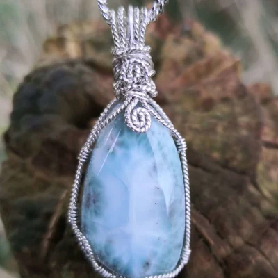 Pretty asymmetrical polished larimar. Can you see the tree image formed by the structure of the stone?