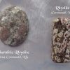 Rhyolite, New Zealand Rhyolite gemstone crystal, New Zealand. Oval and oblong shapes. Bown and peach colours. Oval looks like pebbles under water. Oblong looks like blossoms pressed into a slab of chocolate. White satin background.