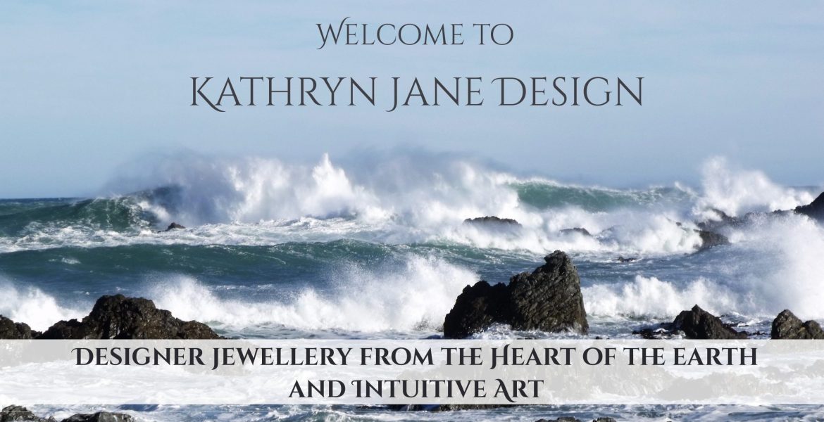 Welcome to Kathryn Jane Design, lovingly handcrafted designer gemstone pendants, from the heart of the earth, and intuitive art. A teal-green, wind-whipped sea powering into rocks with a pale blue sky in the background.