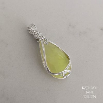 Square sterling silver paired with twisted Argentium for this pear-shaped prehnite pendant.