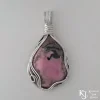 Wire-wrapped Kathryn Jane Design sterling silver rhodonite pendant on white background