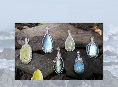 Pendants category image. View available Kathryn Jane Design gemstone pendants. Natural gemstone crystal pendants, wire-wrapped in sterling silver, on stones of riverbed, surrounded by leaves. Crystals include Atlantisite (stichtite in serpentine), labradorite, prehnite and larimar.