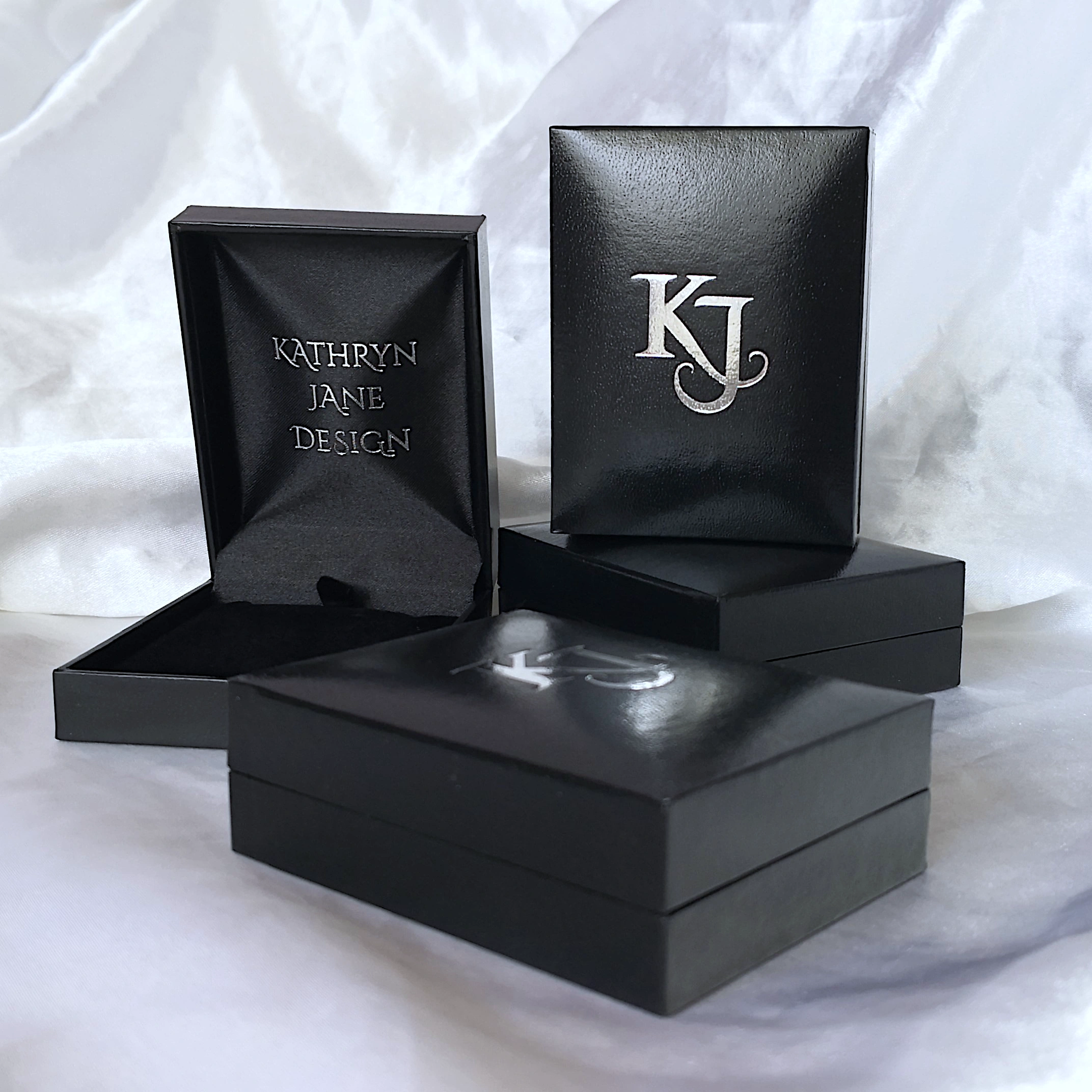 Pendant will be presented in a beautiful Kathryn Jane Design jewellery box - black exterior faux leather with embossed silver K J lettering. White satin background.