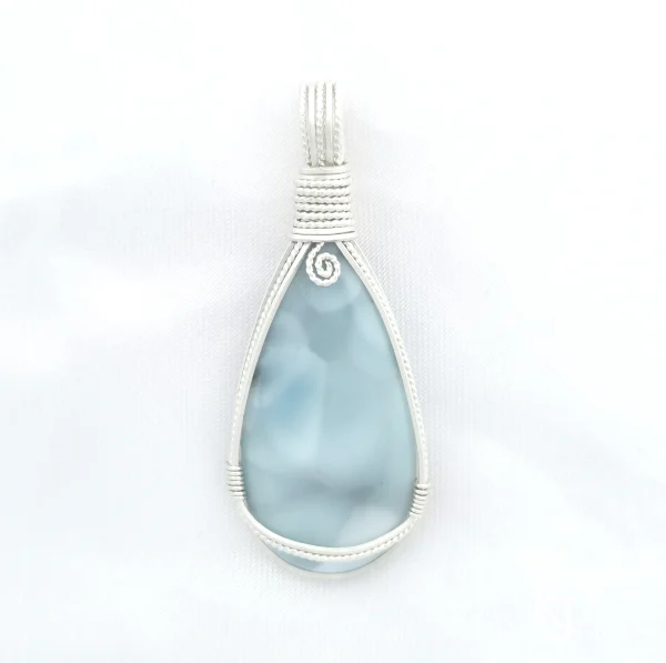 Peardrop-shaped larimar pendant, soft blue-turqoise, framed in sterling silver wire. Kathryn Jane Design