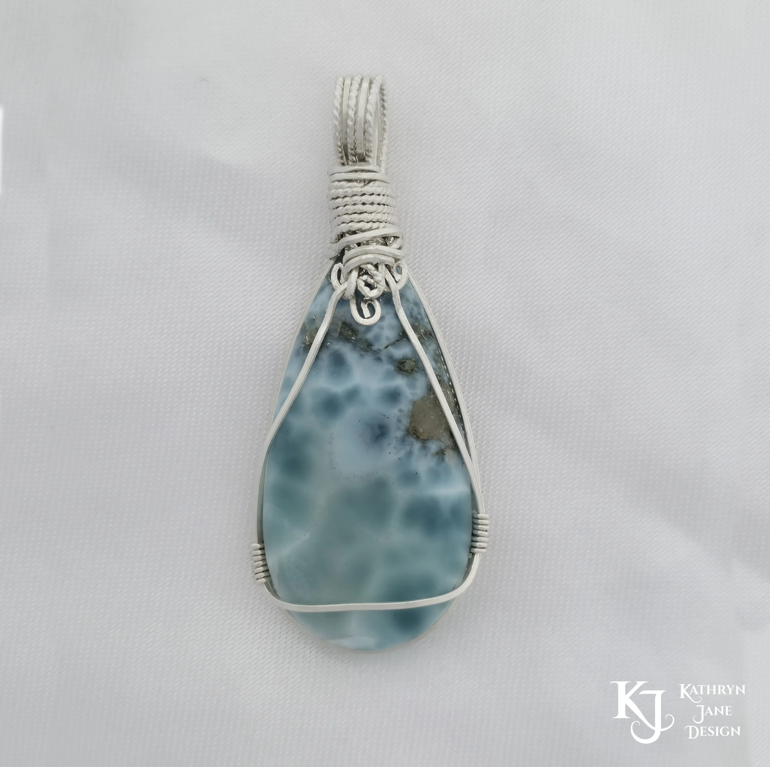 Peardrop-shaped larimar pendant, soft blue-turqoise, framed in sterling silver wire. Reverse side of pendant. Kathryn Jane Design