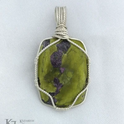 A wonderfully simple design with twisted sterling silver for this pretty Atlantisite oblong pendant