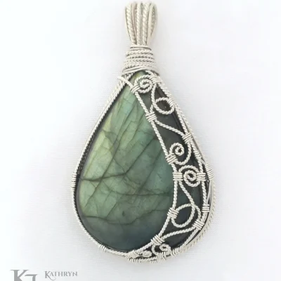 Intricate swirls transform this large pear labradorite into a stunning piece of jewellery