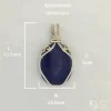 Approximate dimensions: Length 43.5mm, width 23.5mm, depth 5mm Oblong-shaped royal blue lapis lazuli pendant with sterling silver and 14k gold-filled wire spirals at the top, and in the bail, approximate dimensions: Length 43.5mm, width 23.5mm, depth 5mm