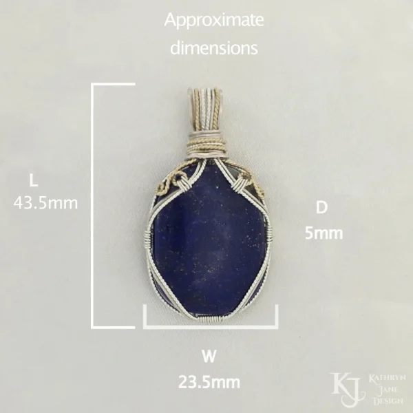 Approximate dimensions: Length 43.5mm, width 23.5mm, depth 5mm Oblong-shaped royal blue lapis lazuli pendant with sterling silver and 14k gold-filled wire spirals at the top, and in the bail, approximate dimensions: Length 43.5mm, width 23.5mm, depth 5mm