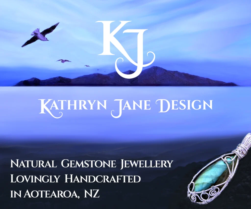 KJ, Kathryn Jane Design logo. White K and J interlocking in centre. Painting in blues and purples showing part of Kapiti Island, New Zealand, in background, with silhouettes of three seagulls flying towards it. A calm sea in middle-distance. Rocks on the foreground, upon them a labradorite gemstone crystal wire-wrapped in sterling silver twisted spirals.